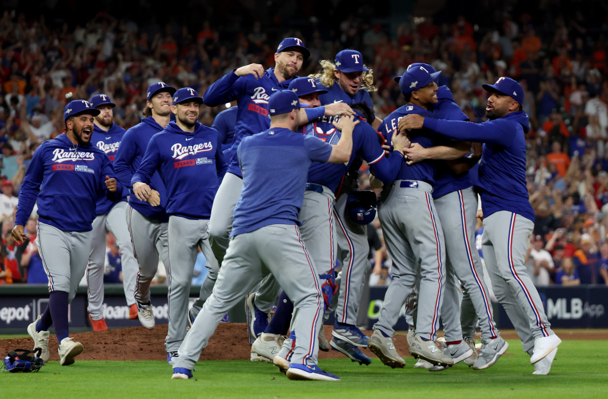 Texas Rangers players celebrate after winning Game 7 in the ALCS over the Houston Astros 11-4 Monday night at Minute Maid Park.